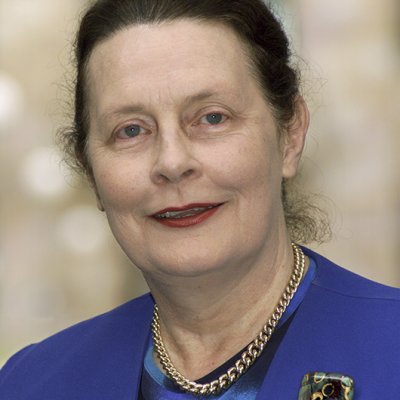 Head shot of a woman in a blue jacket 